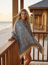 Black and natural geometric Turkish cotton throw blanket with mustard border and tassels