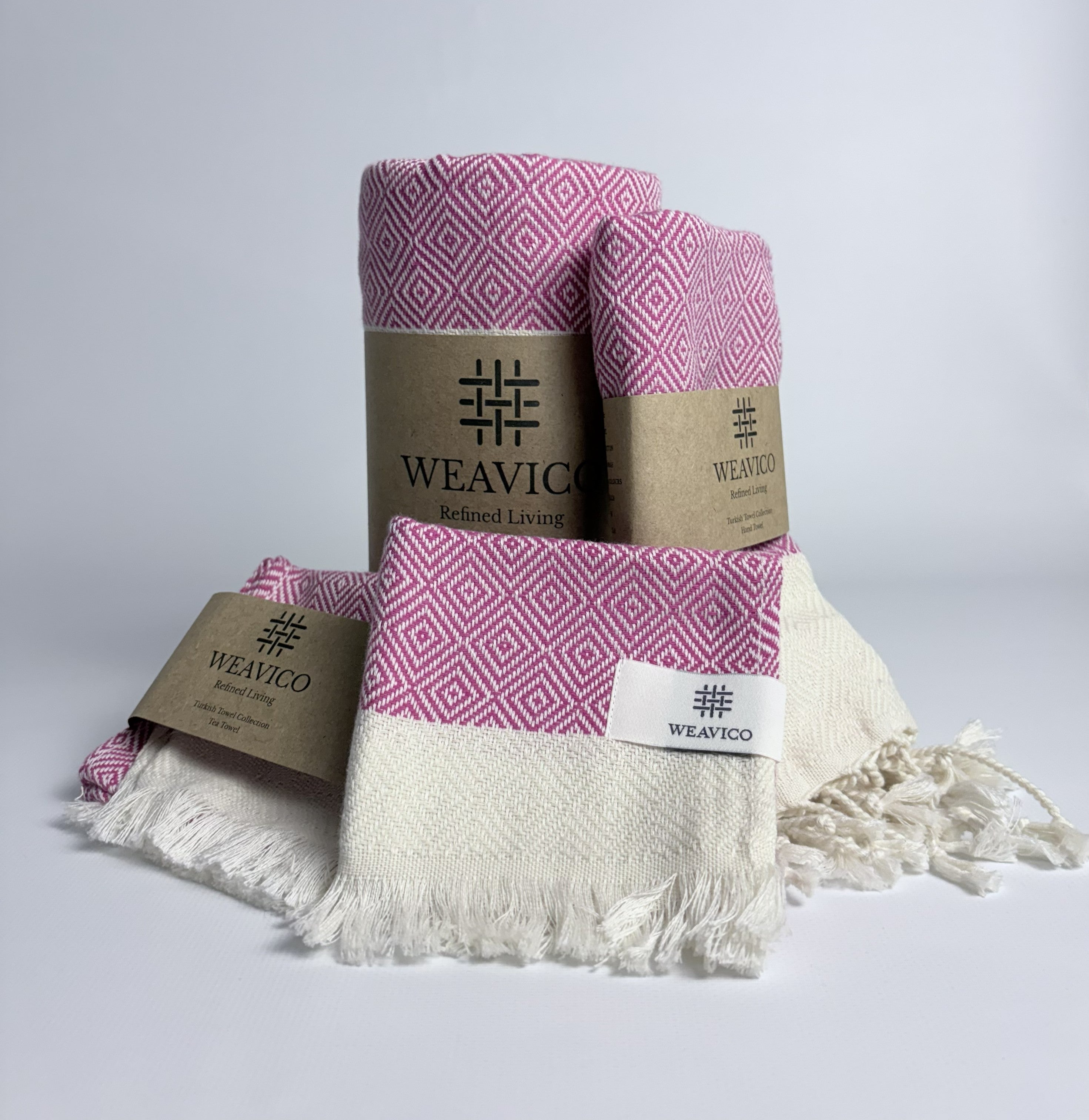 4-piece set that includes Fuchsia and White Diamond Pattern Turkish Towel with End-Border Design and Weavico Label