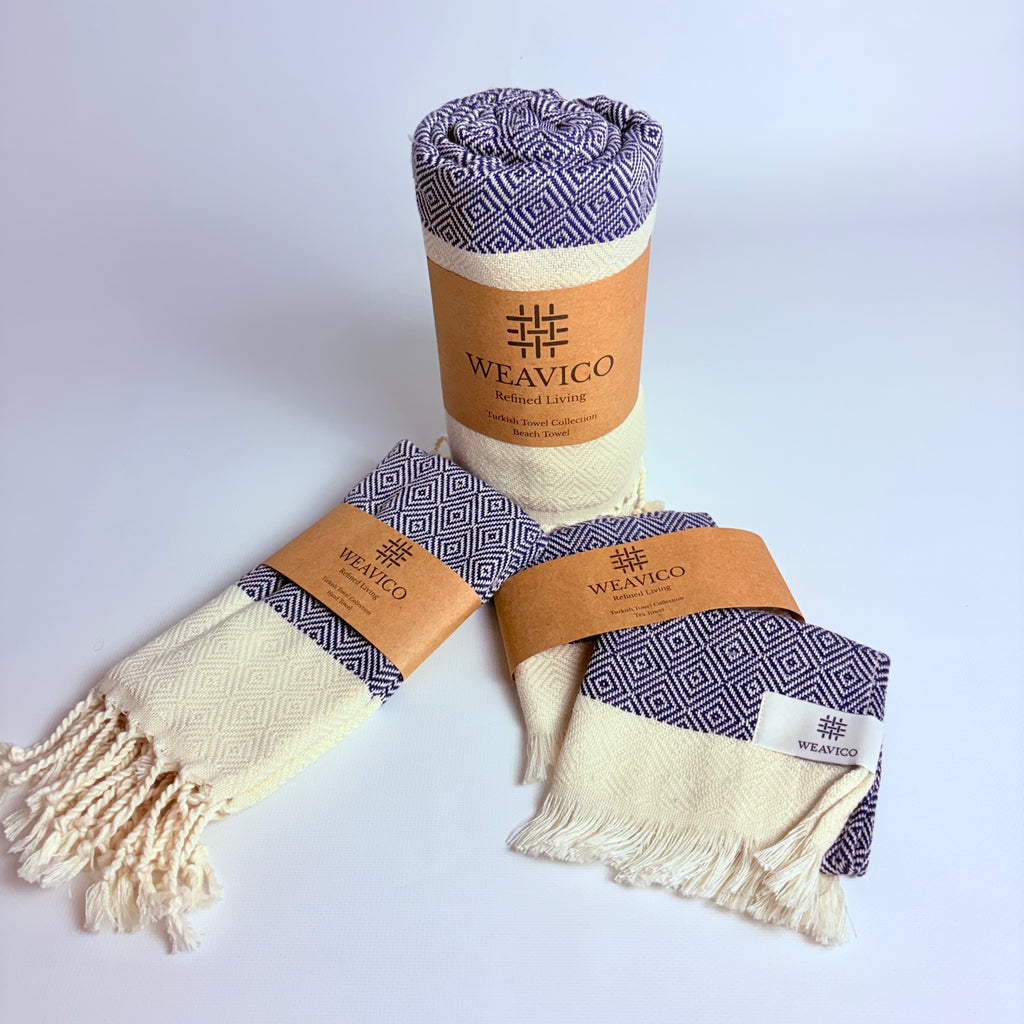 4-piece set that has Navy and White Diamond Pattern Turkish Towel with end-Border Design and Weavico label